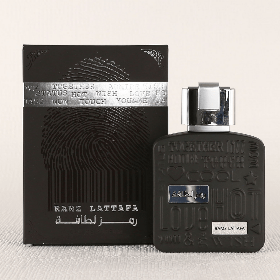 Ramz Lattafa Silver Eau de Parfum spray 100ml bottle, featuring sleek silver design and elegant packaging.