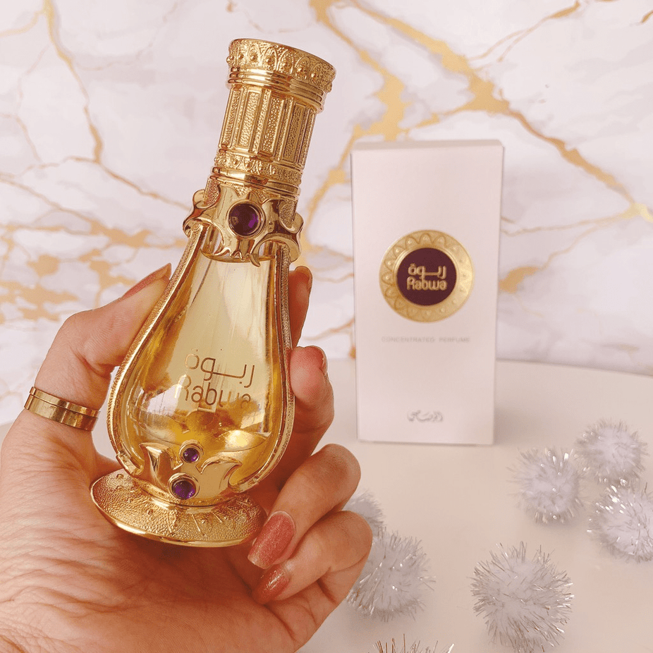 Rabwa Perfume Oil by Rasasi, 19 ML concentrated perfume oil bottle with elegant packaging and branding.