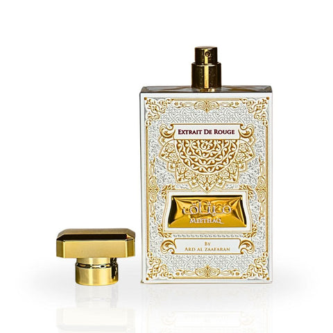 Ard Al Zaafaran Meethaq Extrait De Rouge Eau de Parfum spray 100ml in a velvet pouch, featuring a sleek glass bottle with a gold cap.