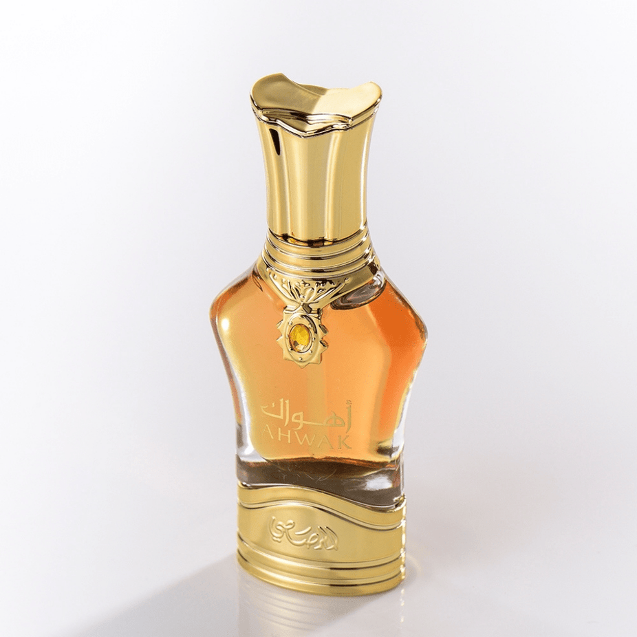 Rasasi Ahwak Al Asfar concentrated perfume oil bottle, 15ml with elegant packaging and golden accents.