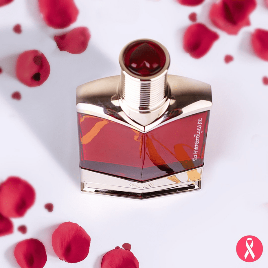 Rasasi Attar Al Mohabba Men EDP 75ml with velvet pouch, showcasing the perfume bottle and luxurious packaging.