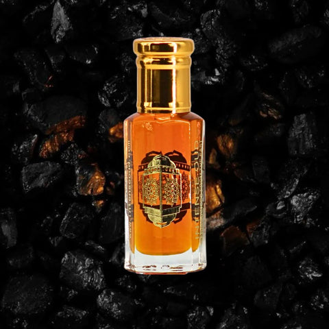Intense Oud Mukhalat Malaki perfume oil in a 12ml glass bottle with black gift box, showcasing luxurious loose oil packaging.