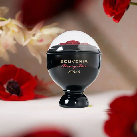 A bundle of two Afnan Souvenir Eau de Parfum sprays, Blooming Bliss and Desert Rose, 100ml each, featuring elegant perfume bottles.