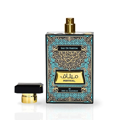 Ard Al Zaafaran Meethaq Eau de Parfum Spray 100ml with velvet pouch, featuring a sleek glass bottle and elegant packaging.