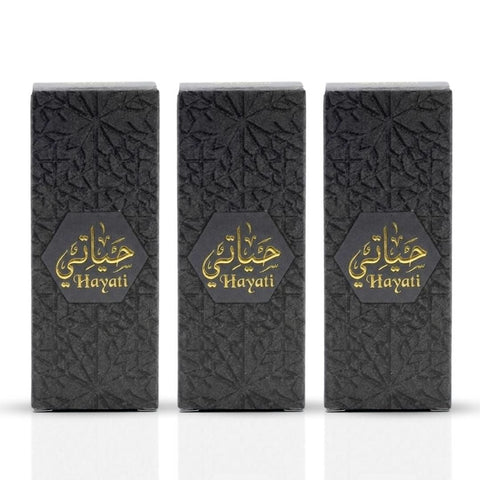 Al Haramain Hayati Concentrated Perfume Oil Set with four 3ml bottles and three refillable bottles, elegant and compact design.