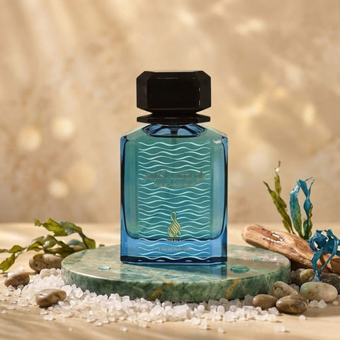 Blue Bomb Extreme Eau de Parfum spray by RISALA in a velvet pouch, 100ml bottle with sleek blue and silver design.