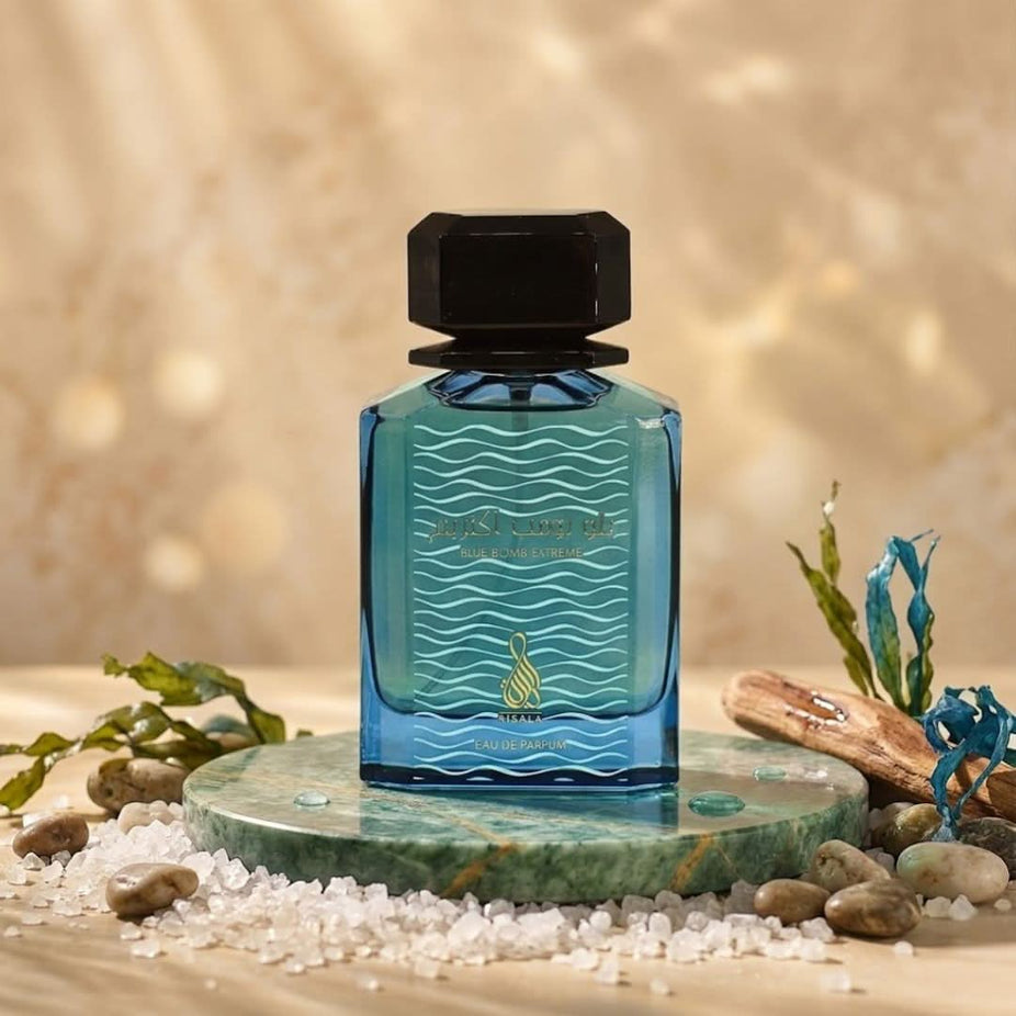 Blue Bomb Extreme Eau de Parfum spray by RISALA in a velvet pouch, 100ml bottle with sleek blue and silver design.