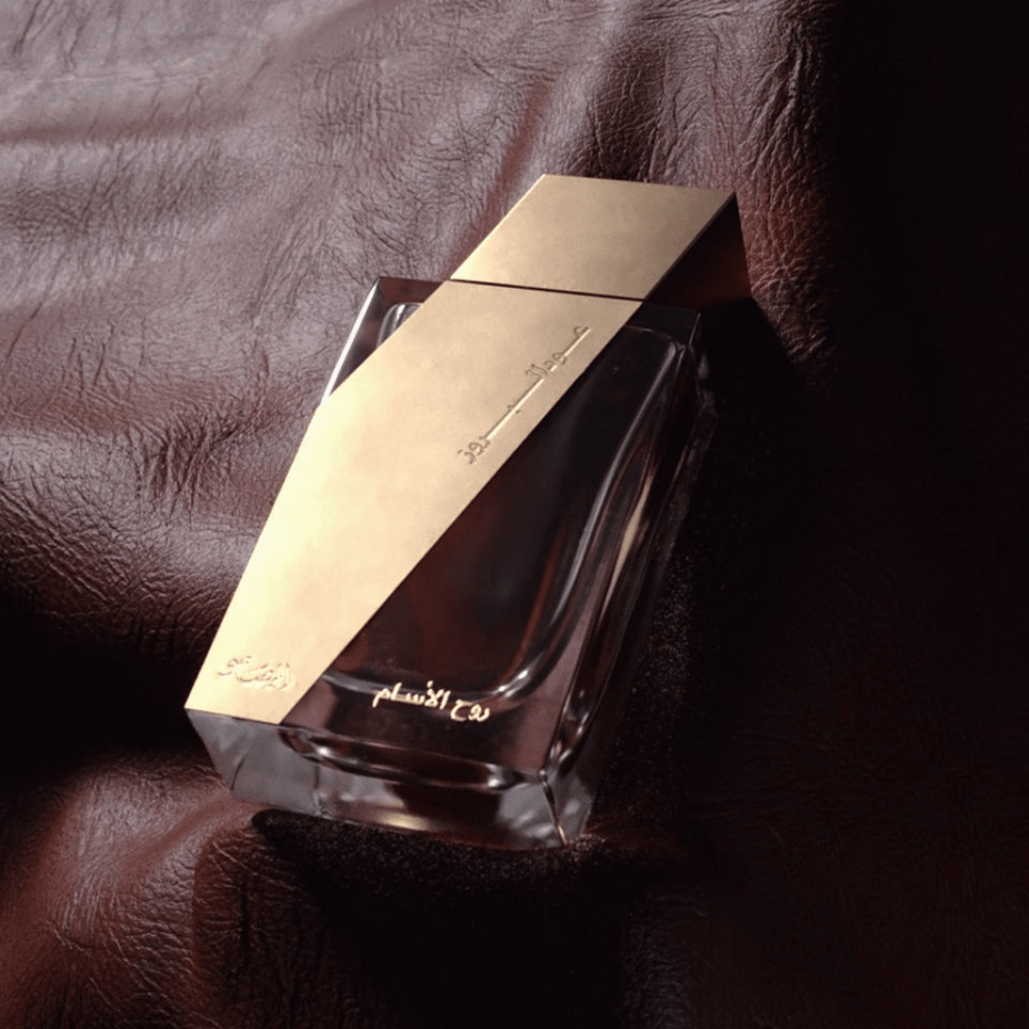 Rasasi Boruzz Rooh Al Assam EDP 50ML perfume bottle with elegant design and floral accents, showcasing the Eau De Parfum.