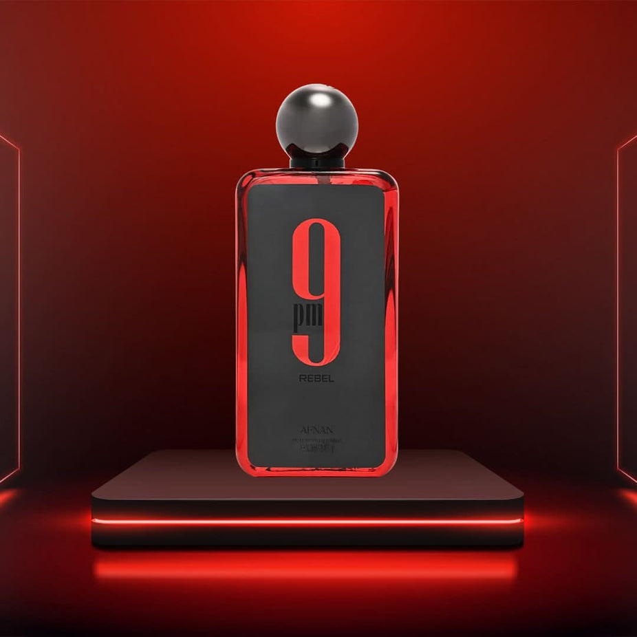 A bundle of two 100ml Afnan 9PM & Rebel Eau de Parfum sprays, featuring sleek bottles with dark and elegant designs.