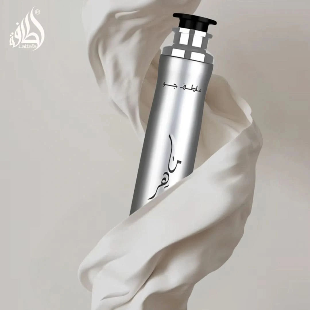 Lattafa Maahir Legacy Air Freshener 300ml bottle with a sleek design, showcasing the product label and transparent container.