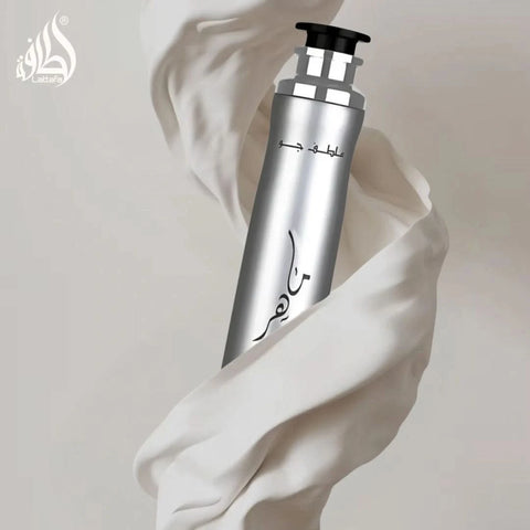 Lattafa Maahir Legacy Air Freshener 300ml bottle with a sleek design, showcasing the product label and transparent container.