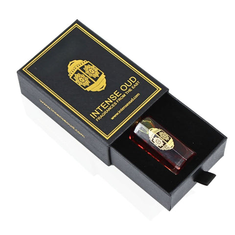 Intense Oud Mukhallat Al Zafran perfume oil 12ml in a black gift box, featuring a clear glass bottle with gold cap and black accents.