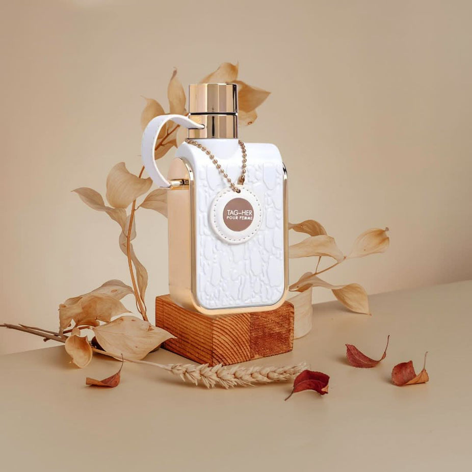 Bundle of Armaf Tag Him & Tag Her Eau de Parfum sprays, 100ml bottles, featuring sleek glass containers with spray nozzles.