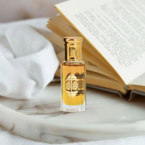 Bundle of Fawaken Crushed & Noble Fruits perfume oils by Intense Oud in 12ml bottles with black gift box, featuring colorful oil bottles.