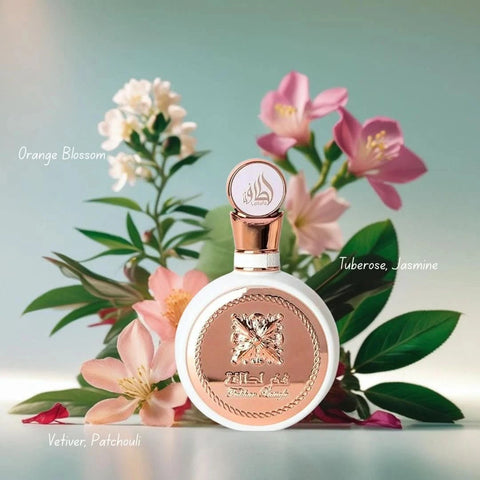 Lattafa Fakhar Women Eau de Parfum spray and all-over spray bundle, 100ml and 150ml bottles, with elegant packaging and floral design.