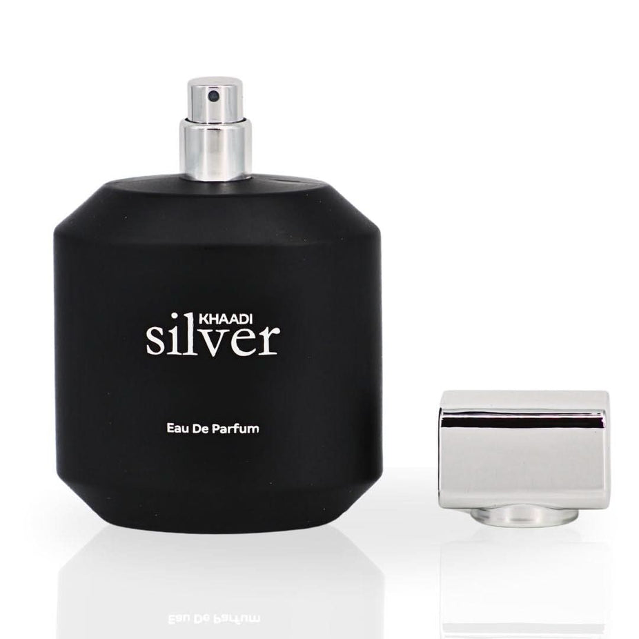 Silver Khaadi Eau de Parfum spray bottle, 100ml, with elegant packaging and perfume mist visible in the image.