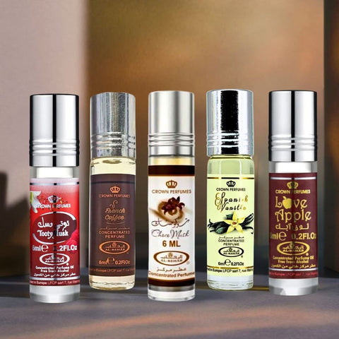 Al Rehab collection of perfume oils featuring Choco Musk, Spanish Vanilla, French Coffee, Love Apple, and Tooty Musk in 6ml bottles.