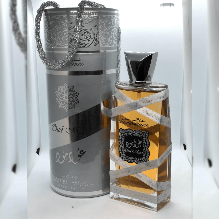 Lattafa Oud Mood Reminiscence Eau De Parfum 100ML bottle with elegant packaging and floral accents.