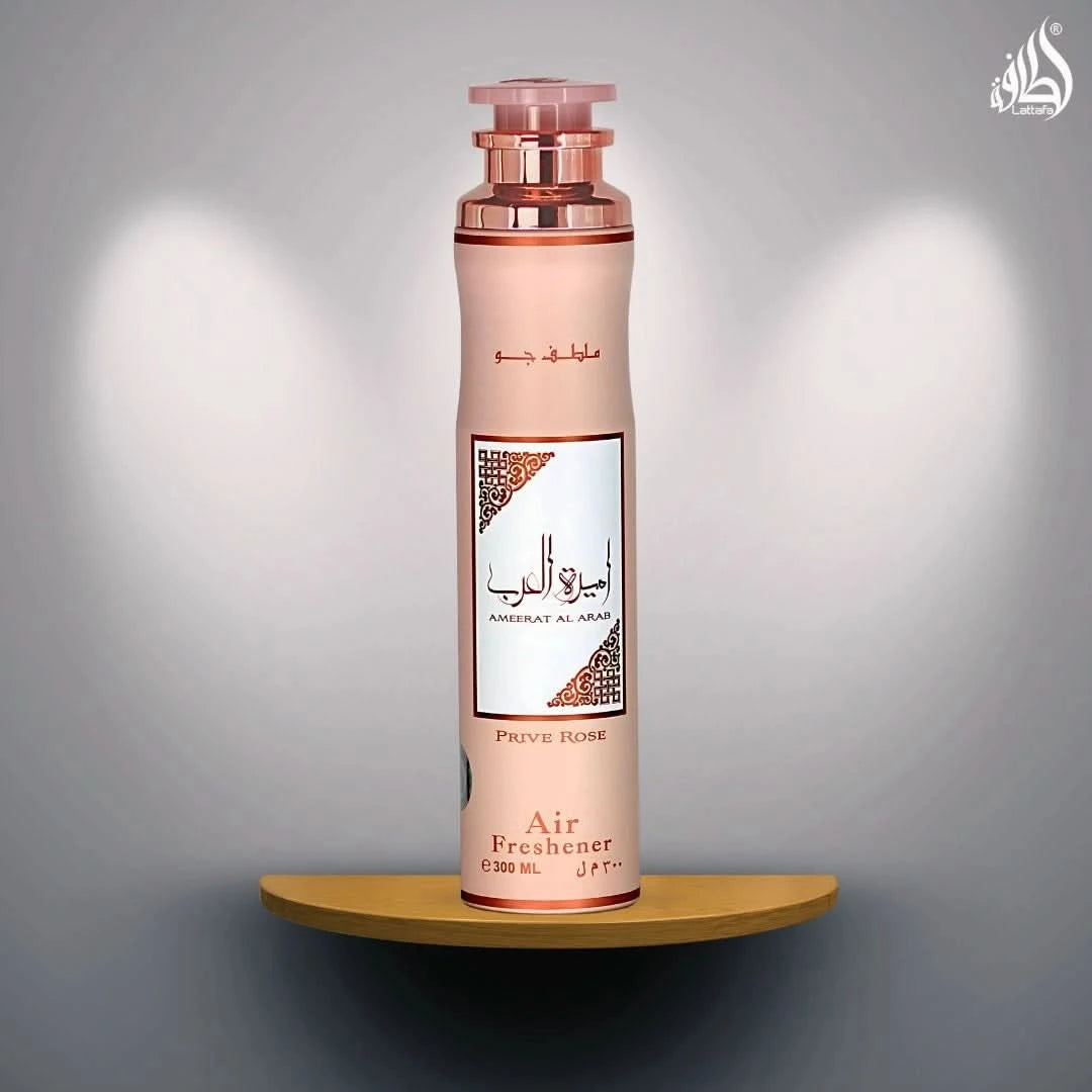Lattafa Ameerat Al Arab Prive Rose air freshener bottle, 300ml, with floral rose design and spray nozzle visible.