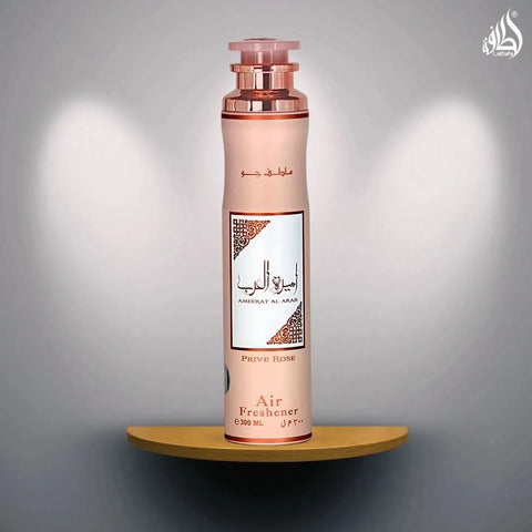 Lattafa Ameerat Al Arab Prive Rose air freshener bottle, 300ml, with floral rose design and spray nozzle visible.