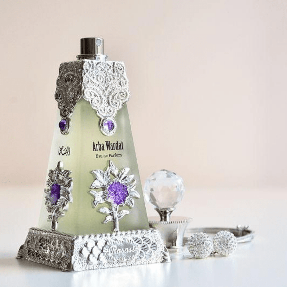 Rasasi Arba Wardat Eau de Parfum bottle with elegant floral design, 70ml size, showcasing a luxurious fragrance presentation.