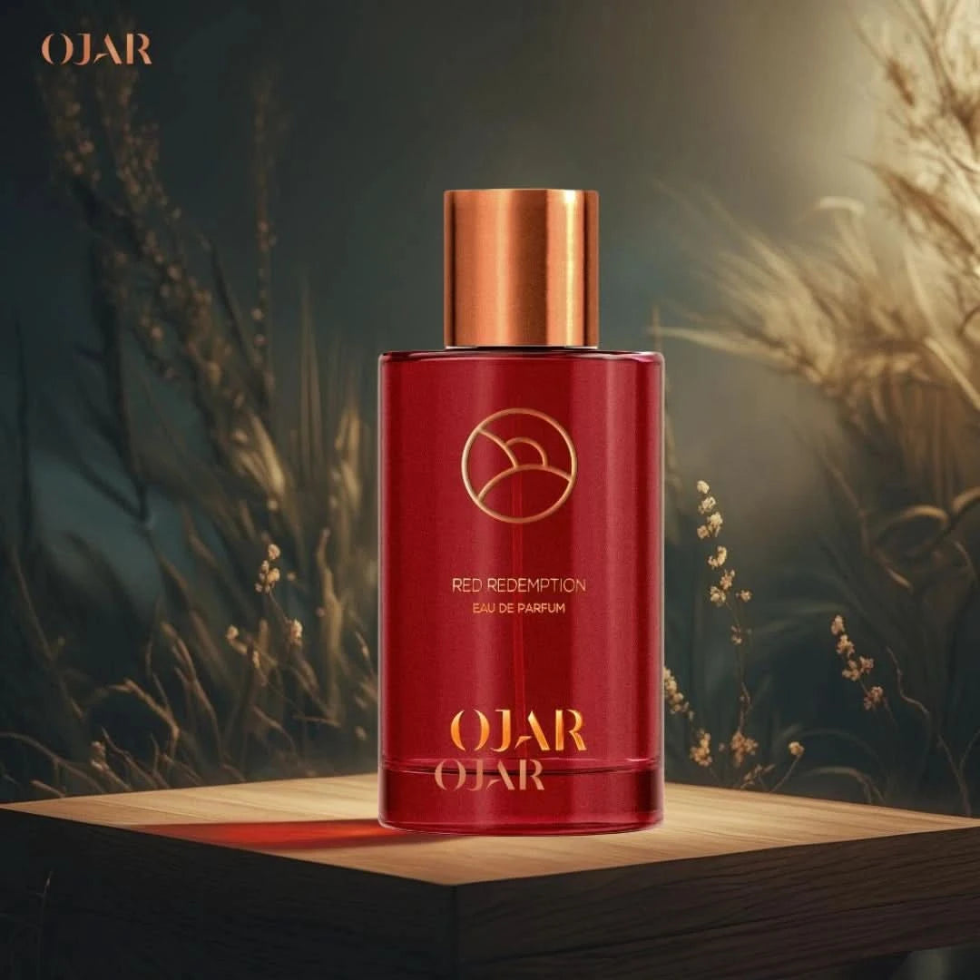 Red Redemption Eau de Parfum spray by Ojar, 100ml, featuring a sleek red bottle with elegant design and branding.