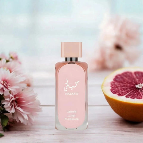 Hayaati Florence Eau De Parfum spray by Lattafa in a velvet pouch, 100ml bottle with elegant fragrance design.