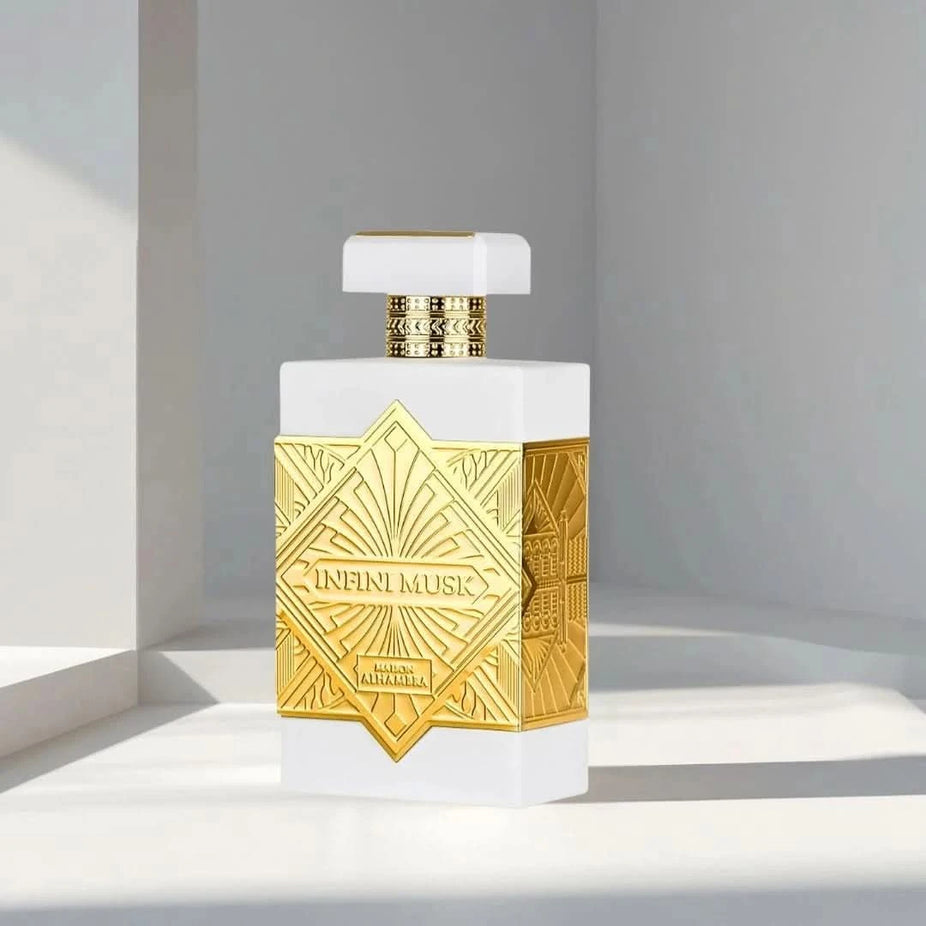 Maison Alhambra Infini Musk Eau de Parfum spray 100ml in a velvet pouch, showcasing the elegant perfume bottle and packaging.