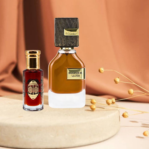 Intense Oud Saheb Eau de Parfum spray and Mukhallat Al Zafran perfume oil bundle, featuring elegant bottles and packaging.