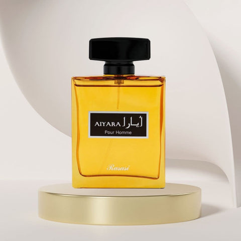 A close-up of Aiyara Pour Homme EDP by Rasasi, 100ML bottle with luxurious, spicy, woody, and sweet masculine scent packaging.