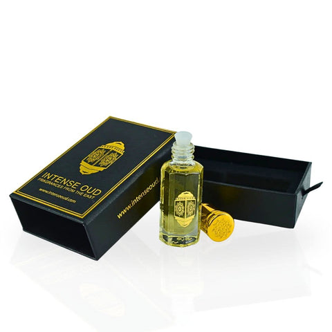 Intense Oud Casual Hangout perfume oil in a 12ml bottle with a black gift box, showcasing a sleek, transparent glass container.
