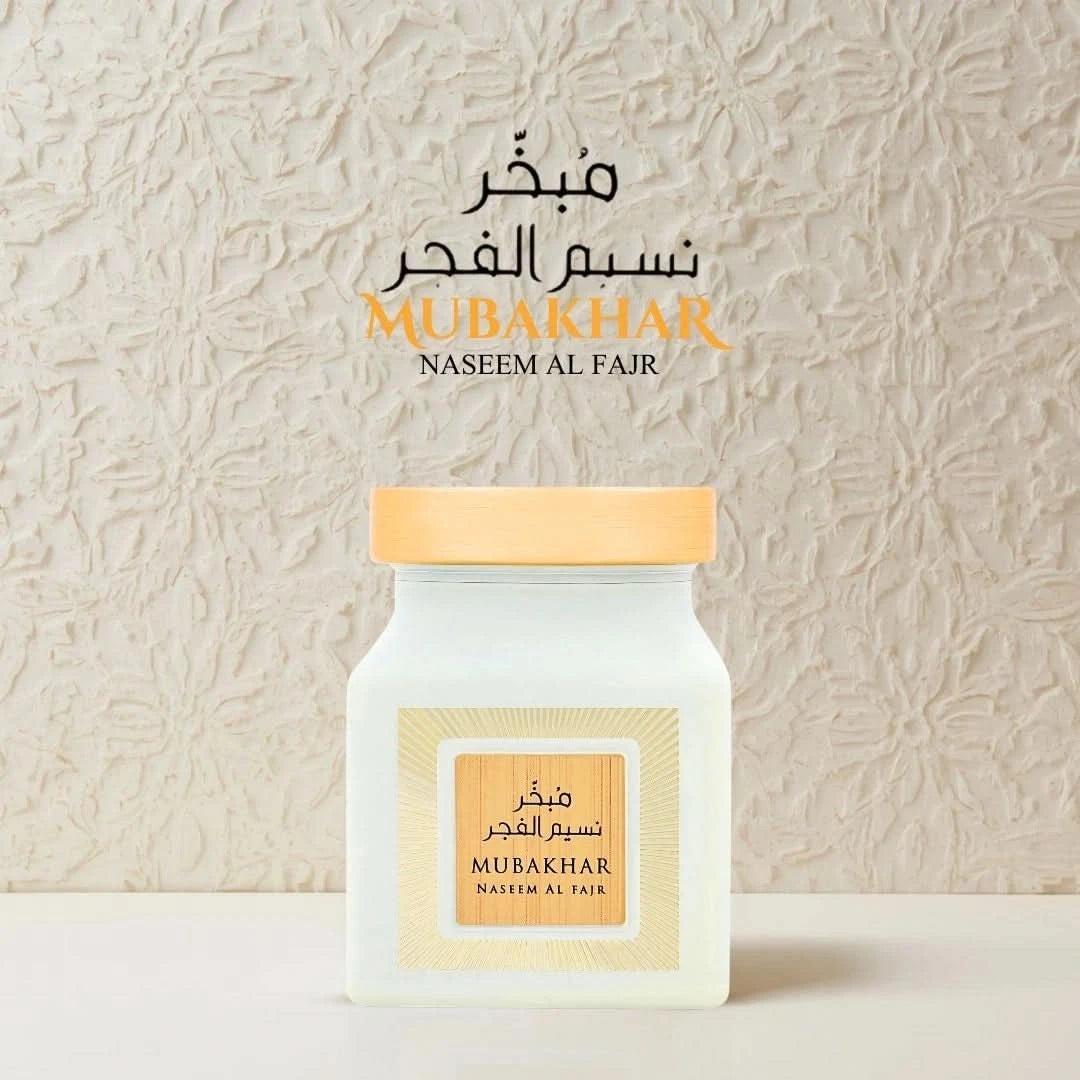 Rasasi Mubakhar Naseem Al Fajr Oudh Moattar Bakhoor 50g, fragrant burnt incense with aromatic oudh scent in a decorative container.