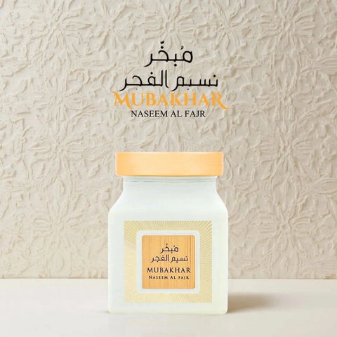 Rasasi Mubakhar Naseem Al Fajr Oudh Moattar Bakhoor 50g, fragrant burnt incense with aromatic oudh scent in a decorative container.