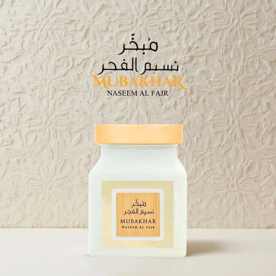 Rasasi Mubakhar Naseem Al Fajr Oudh Moattar Bakhoor 50g, fragrant incense in a decorative container, traditional Middle Eastern scent.