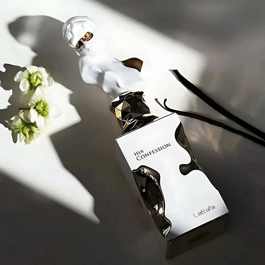 Lattafa His & Her Confession Eau de Parfum bundle with two 100ml spray bottles, sleek design, and elegant packaging.