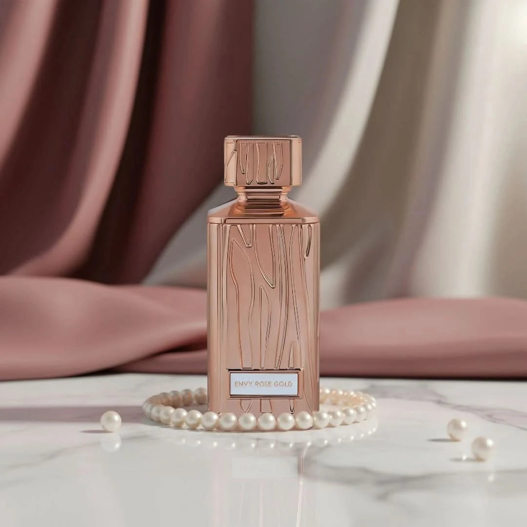 Hamidi Envy Rose Gold Eau de Parfum spray 100ml with velvet pouch, featuring elegant rose gold bottle and floral fragrance.