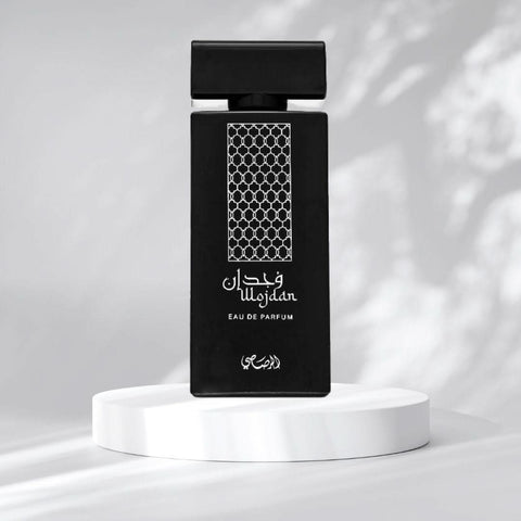 Rasasi Wojdan EDP Spray 100ml with warm spicy, floral, woody, and exotic unisex scent in a sleek perfume bottle.