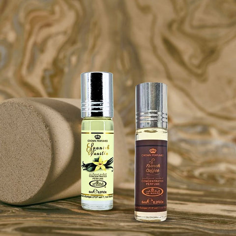 Bundle of Al Rehab Spanish Vanilla and French Coffee perfume oils in 6ml bottles, featuring elegant packaging and vibrant labels.