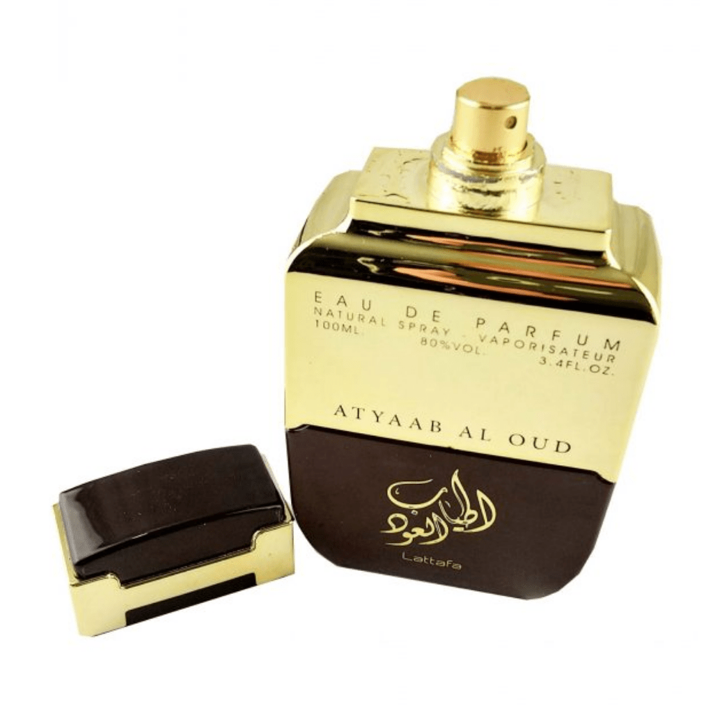 Lattafa Atyaab Al Oud EDP 100ML bottle with velvet pouch, showcasing the elegant perfume packaging and design.