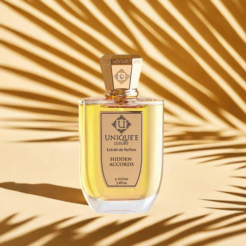 Unique'e Luxury Hidden Accords Extrait de Parfum 100ml EDP bottle with elegant packaging and minimalist design.