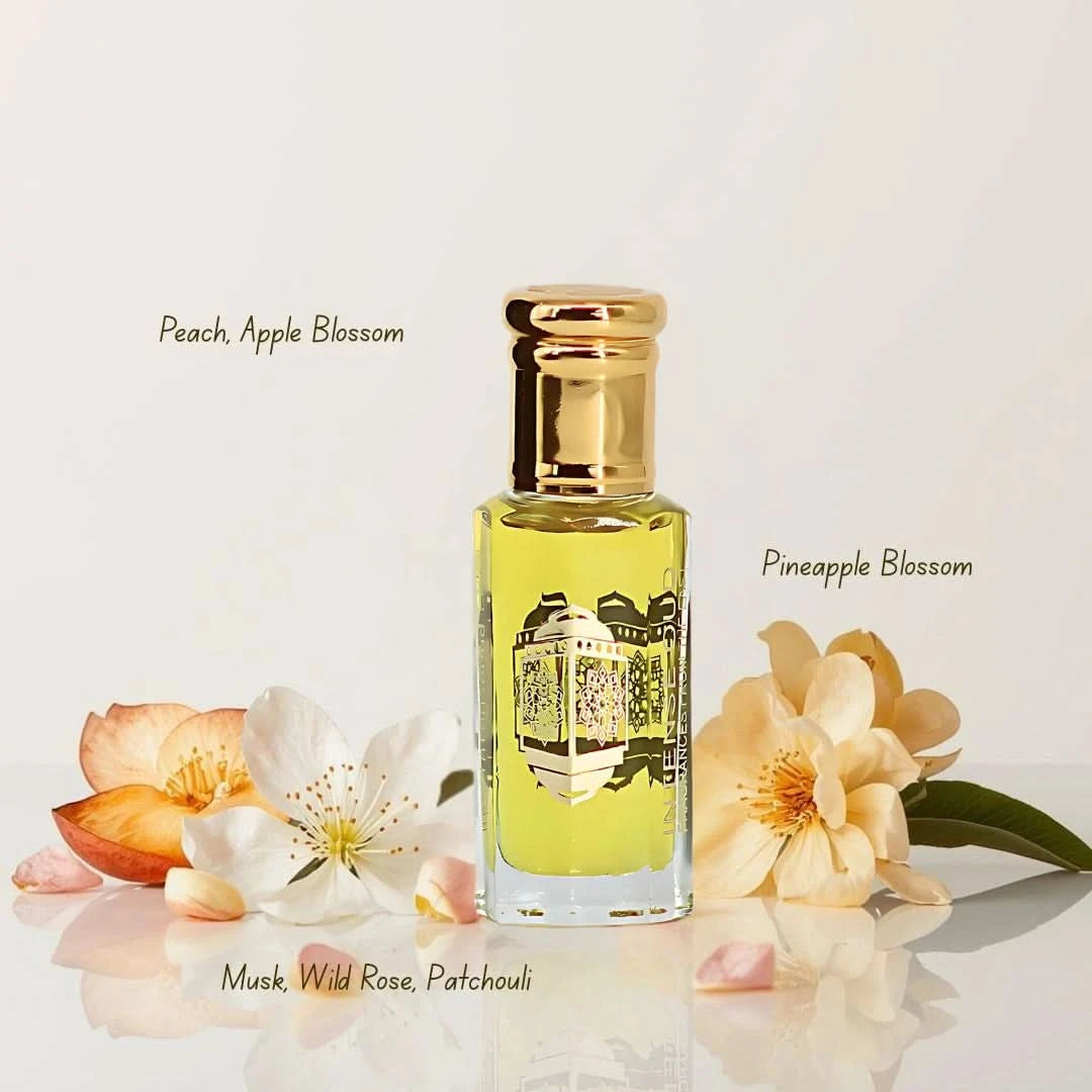 Intense Oud Rouje Madawi and Vanilla Musk perfume oils bundle, 12ml each, featuring elegant glass bottles with labels and decorative caps.