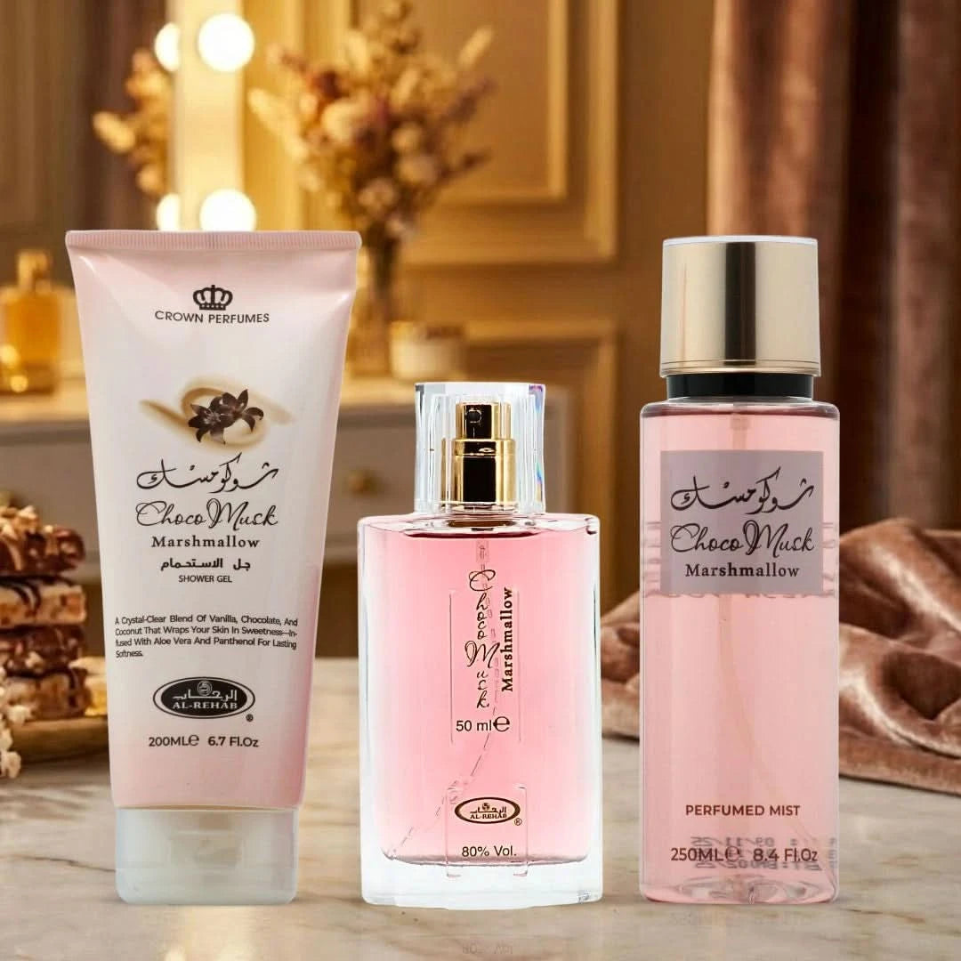 Al Rehab Choco Musk Marshmallow 3-piece perfume gift set with three elegant bottles displayed on a neutral background.