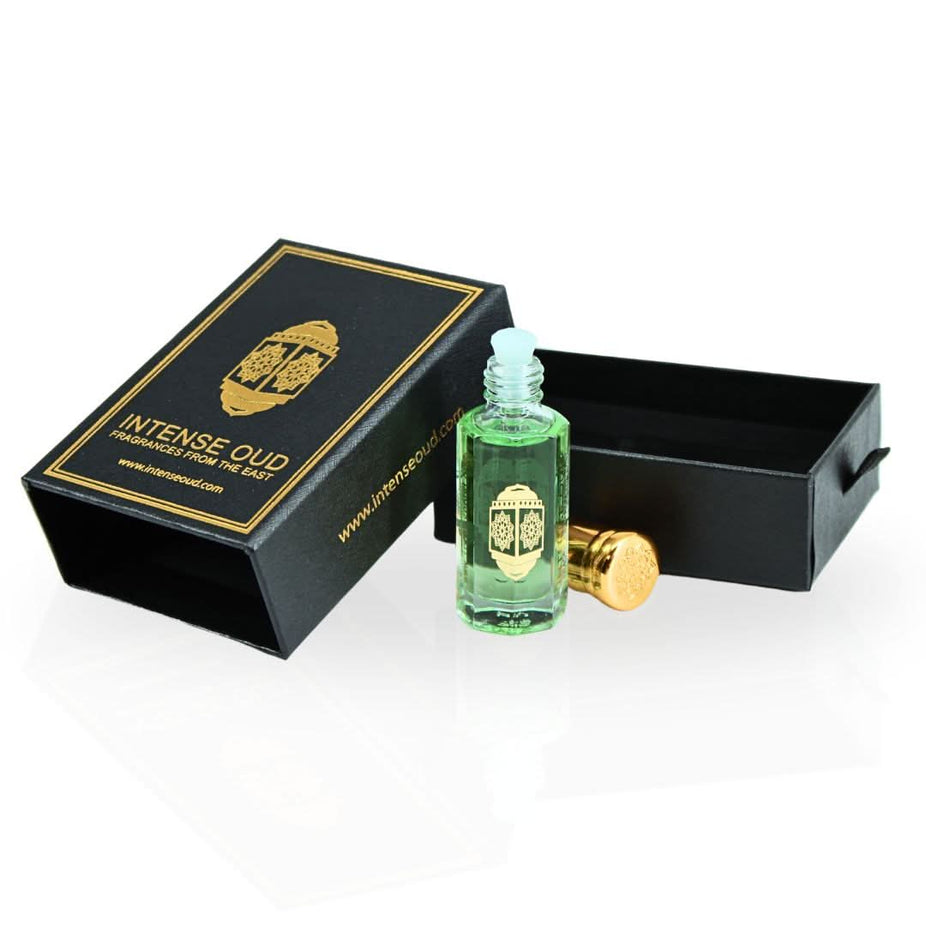 Intense Oud Fajr perfume oil in a 12ml glass bottle with black gift box, showcasing the luxurious loose oil and elegant packaging.