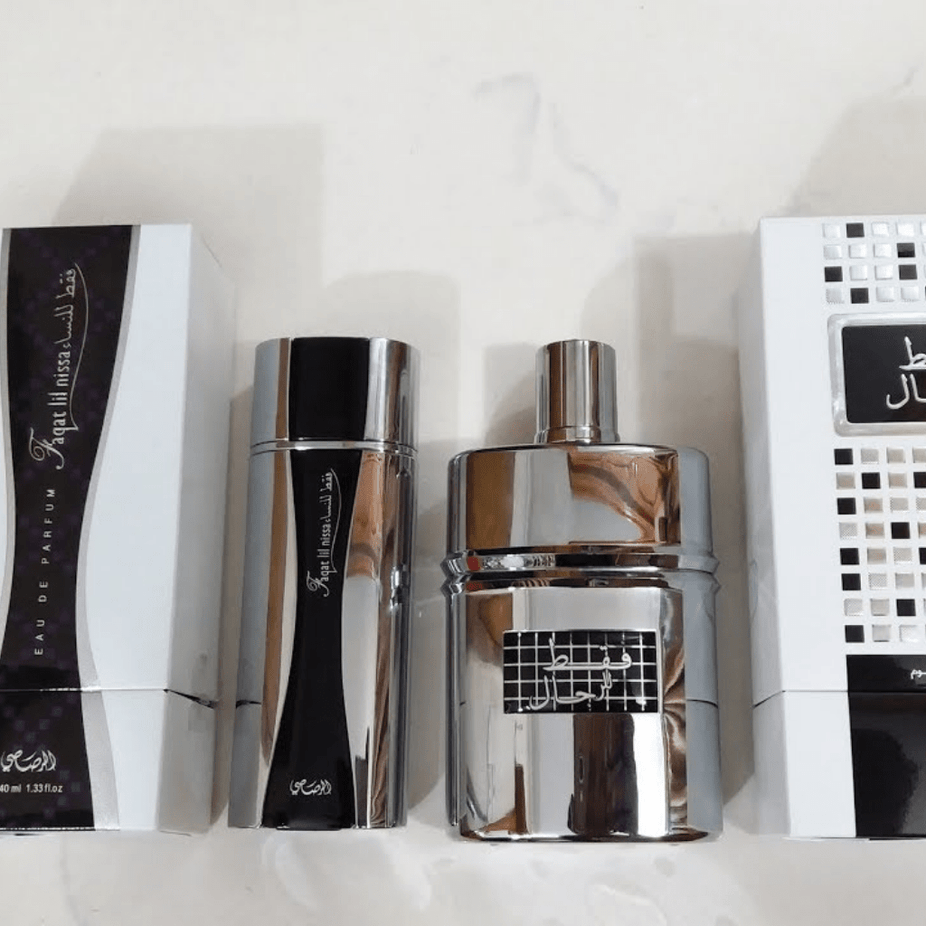 Rasasi Faqat EDP couple perfume set with two 100ml bottles, one for men and one for women, displayed in a bundle.