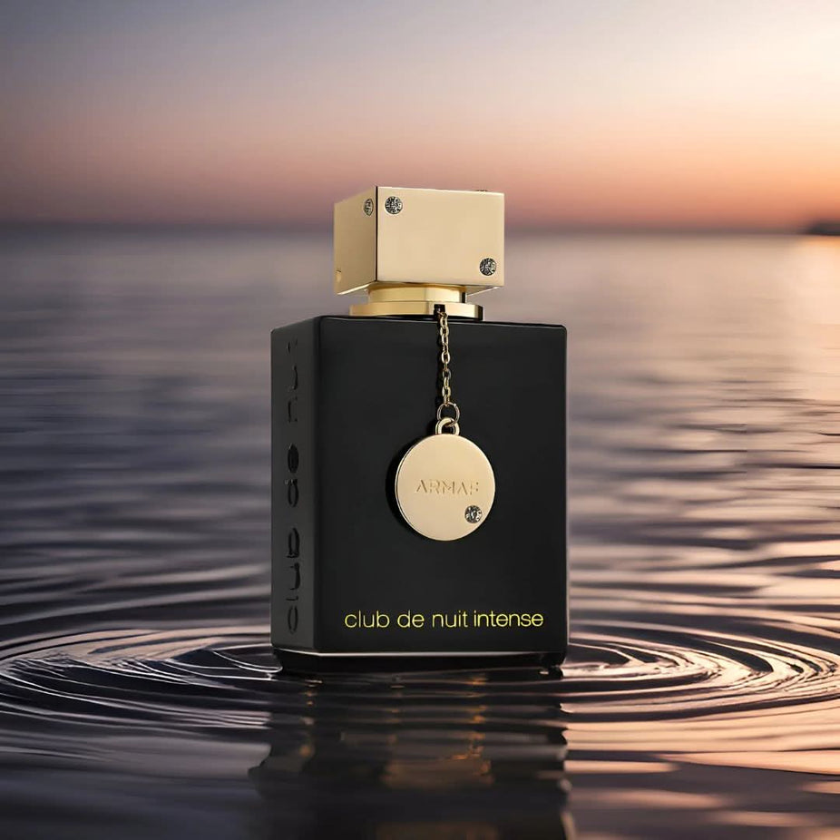 Armaf Club De Nuit Intense Men EDT and Women EDP bundle, 105ml each, shown in sleek spray bottles with black caps.
