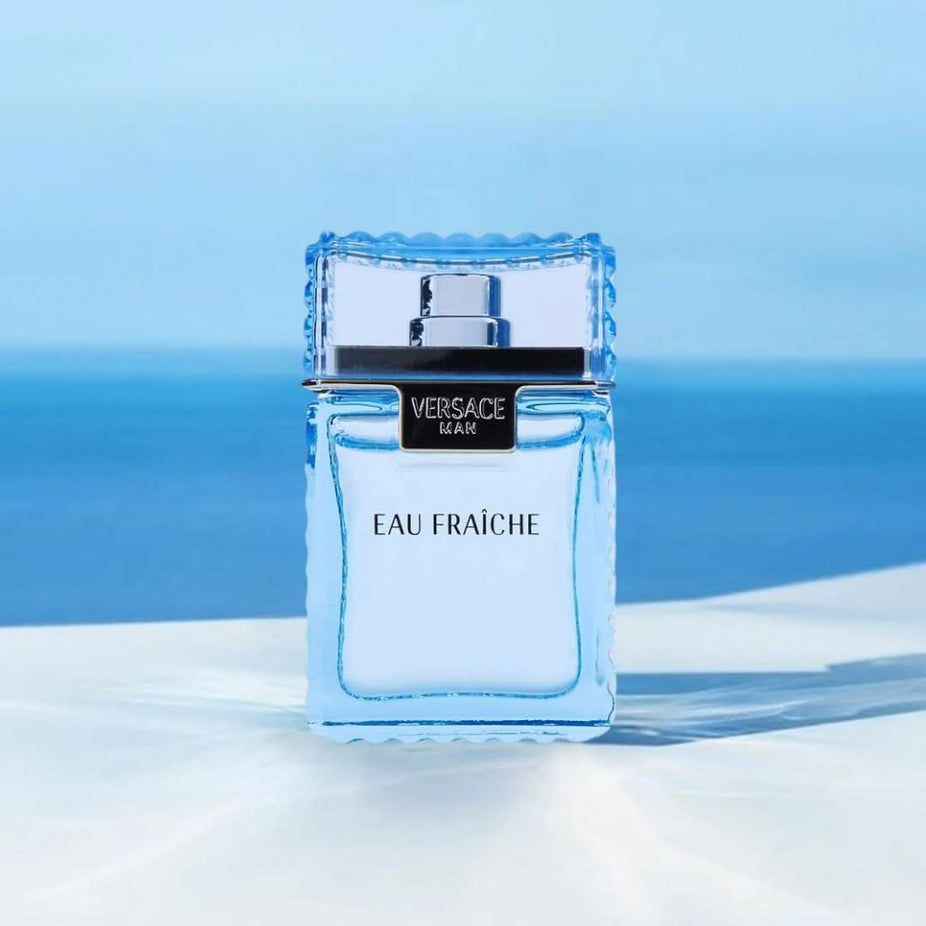 Small vial of Versace Man Eau Fraiche Cologne EDT 5ML, featuring the luxurious fragrance miniature in clear glass with Versace branding.