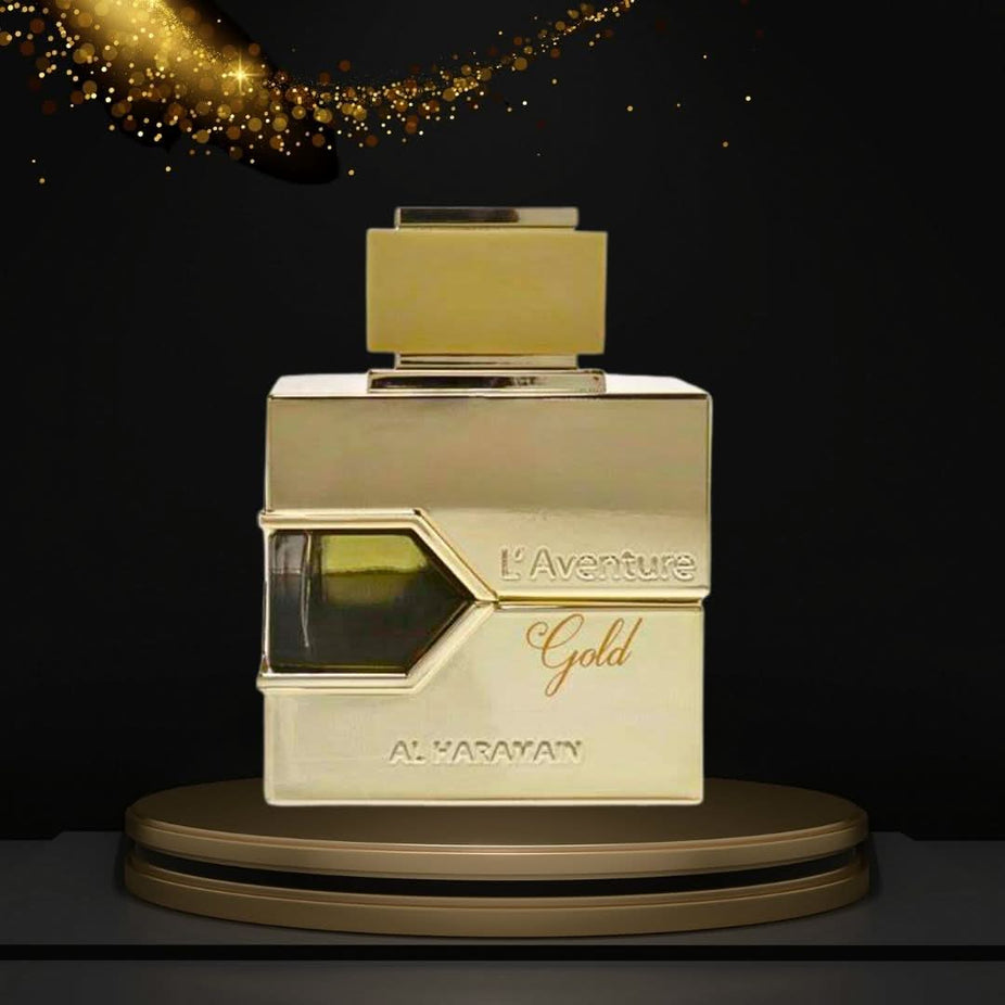 Al Haramain L'Aventure Gold EDP spray 100ml with floral, luxurious feminine scent, showcasing the perfume bottle.