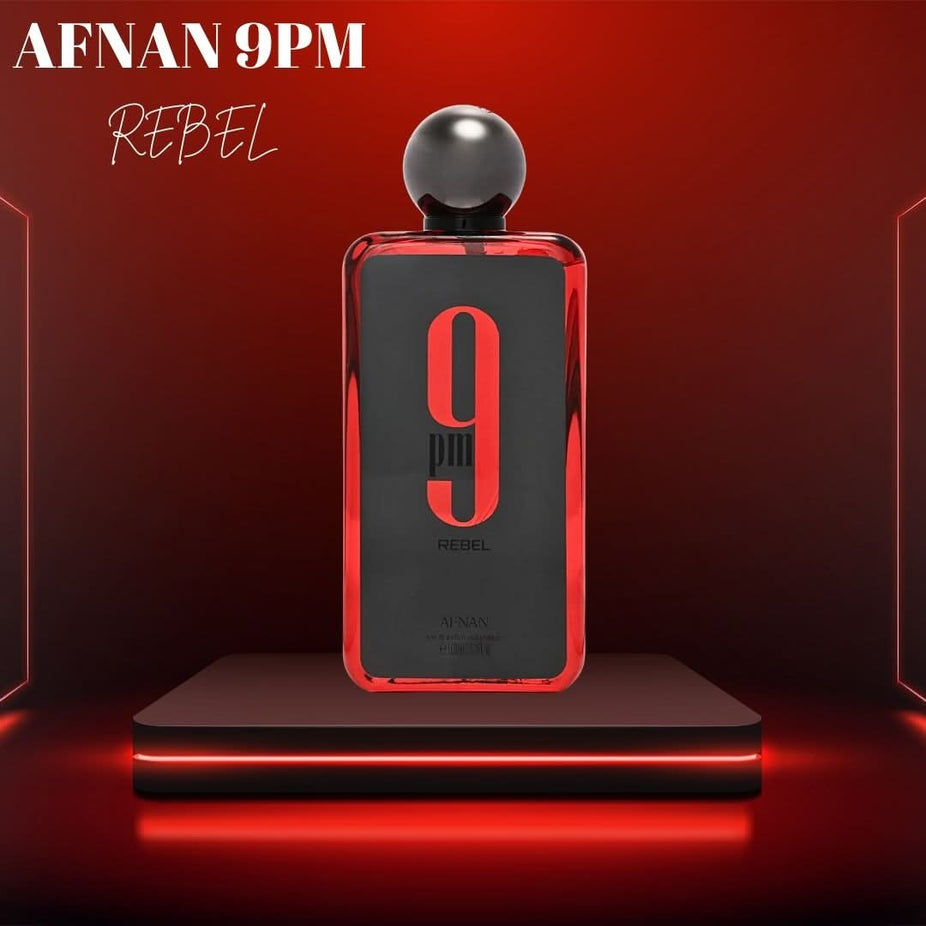 Afnan 9PM Rebel Eau de Parfum spray bottle, 100ml, with sleek design and elegant packaging visible in the image.