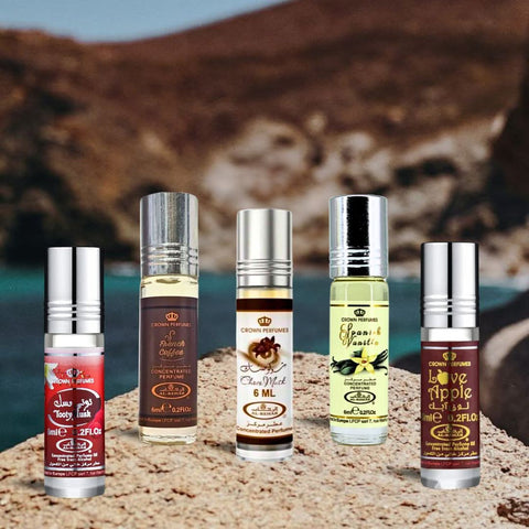 Collection of Al Rehab perfume oils featuring Choco Musk, Spanish Vanilla, French Coffee, Love Apple, and Tooty Musk in 6ml bottles.