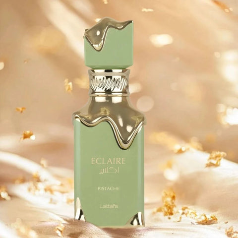 Lattafa Eclaire Pistache Eau de Parfum spray 100ml with velvet pouch, featuring a sleek bottle with pistachio-inspired design.